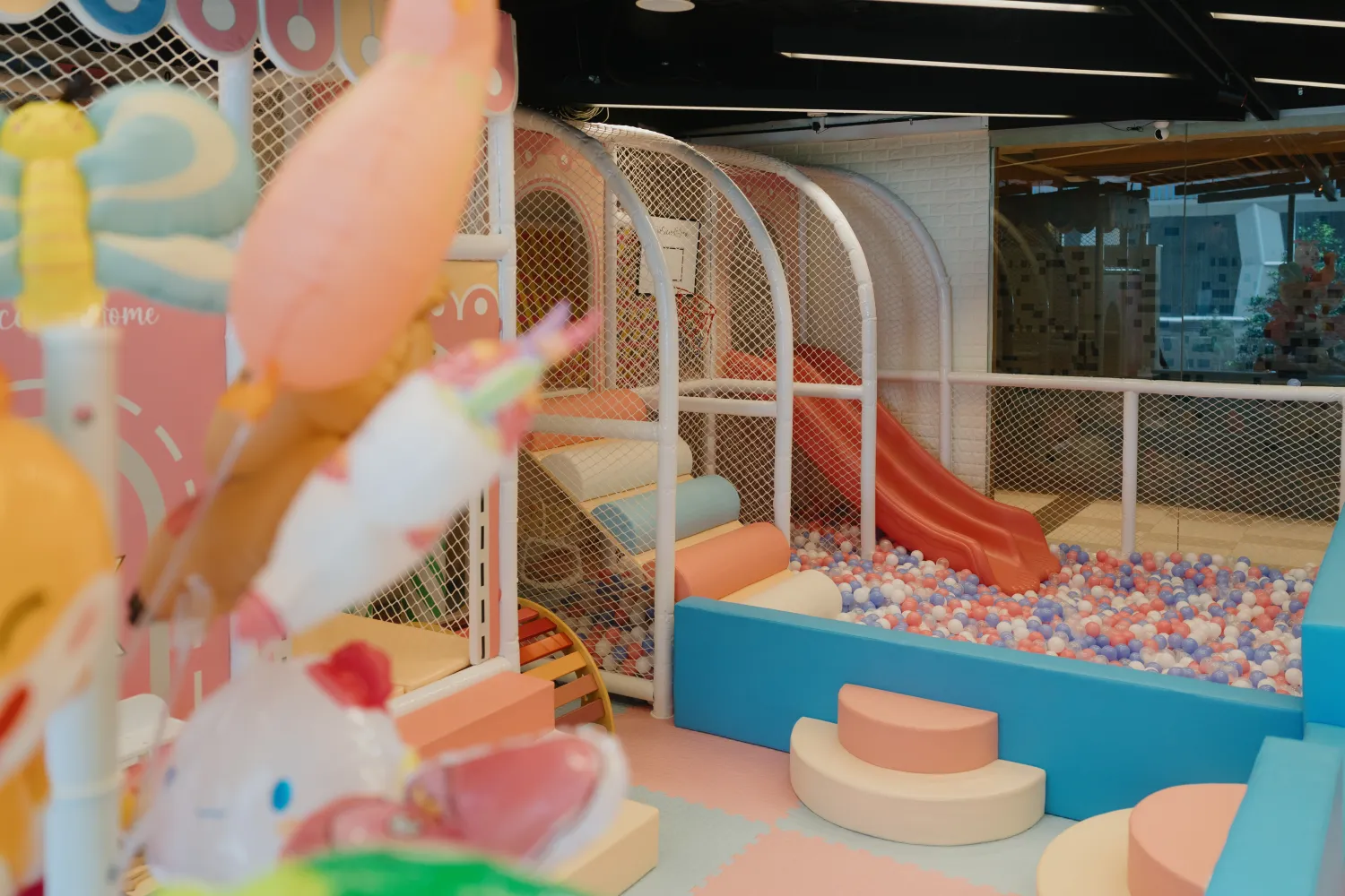Little ones padding around the indoor playground at OurSecondHome, OUE Downtown